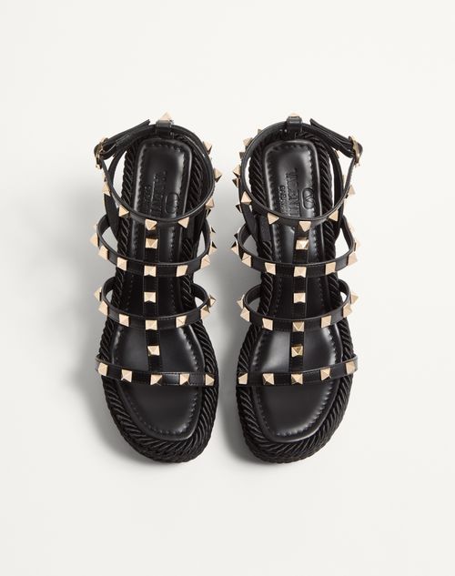 Valentino Garavani - Rockstud Ankle Strap Wedge Sandal In Calfskin Leather 95 Mm - Black - Woman - Espadrilles And Wedges